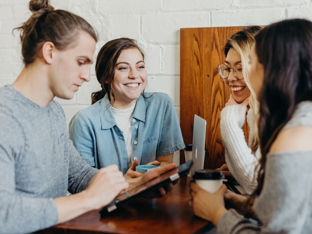 Business owners reviewing their store together on a laptop