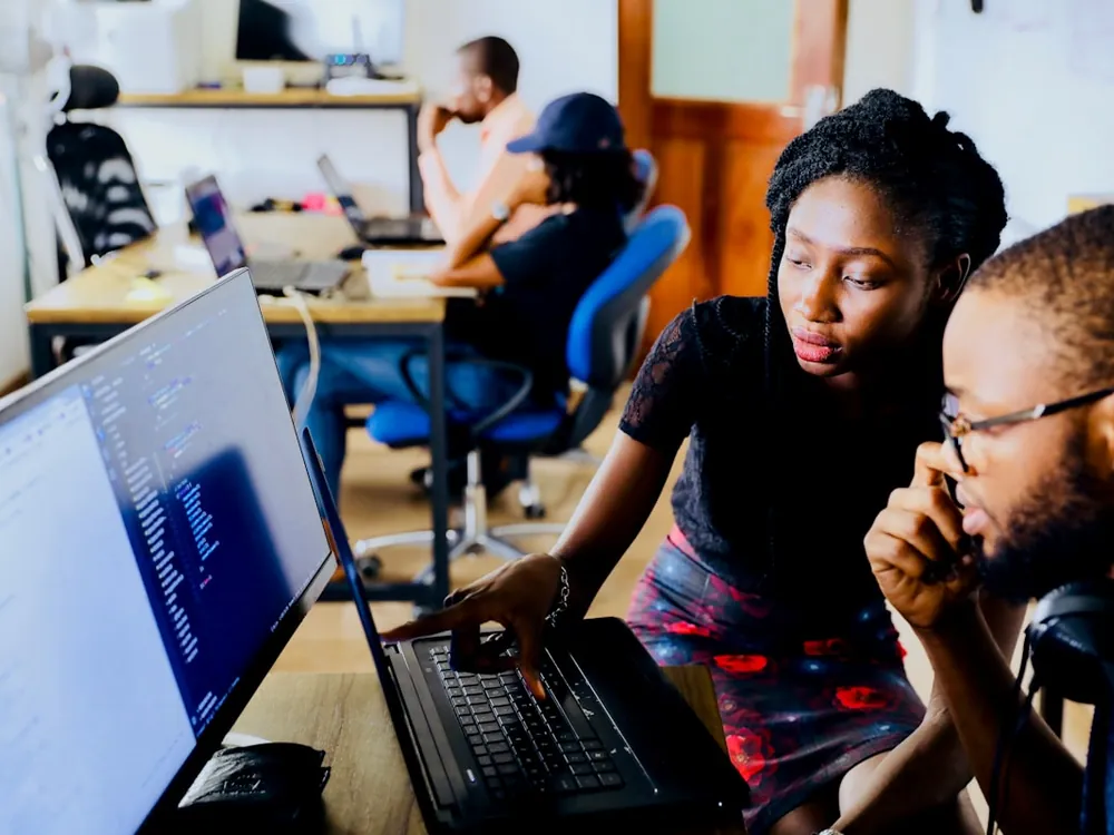 Founders working together at a laptop, getting set up